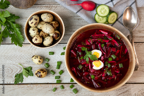 Cold beetroot soup with vegetables, eggs, herbs. Traditional cuisine. Healthy food. Vegetarian food.
