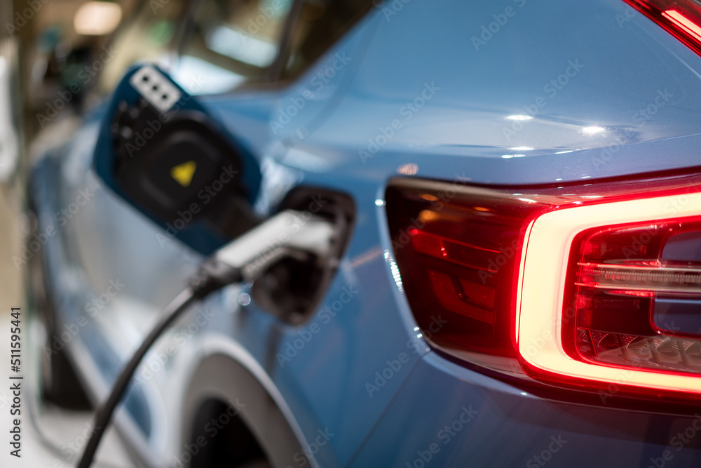 Power supply connect to electric vehicle for charge to the battery. . EV fuel Plug in hybrid car. Power supply connect to electric vehicle for charge to the battery. . EV fuel Plug in hybrid car.