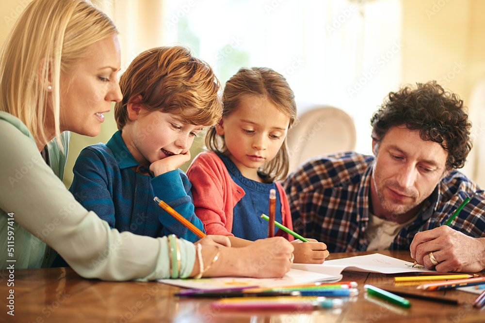 Time to get creative. Cropped shot of a family drawing and colouring in pictures together at home. Time to get creative. Cropped shot of a family drawing and colouring in pictures together at home.