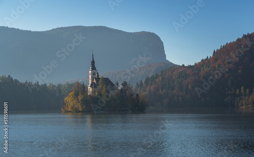 Lake Bled with perfect reflection in autumn season photo