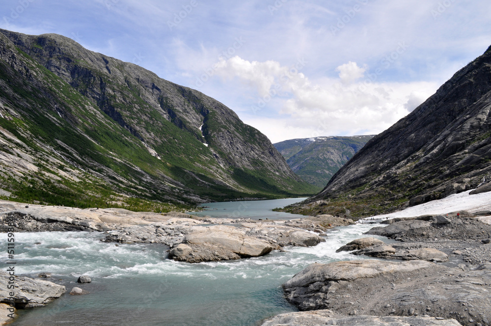 Deep glacial valley with a lake between rocks in Jostedalsbreen National Park with Norway in northern Europe.