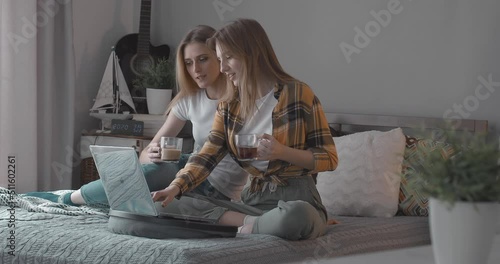 Beautiful Happy Lesbian Couple watching a movie together on a date