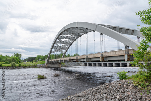 A bridge crosses the Montreal River in the small town of Latchford, Ontario on an overcast day.