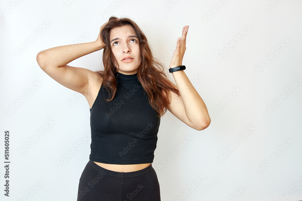 The beautiful girl took her hand to her head. Emotion of despair. The beautiful girl took her hand to her head. Emotion of despair.