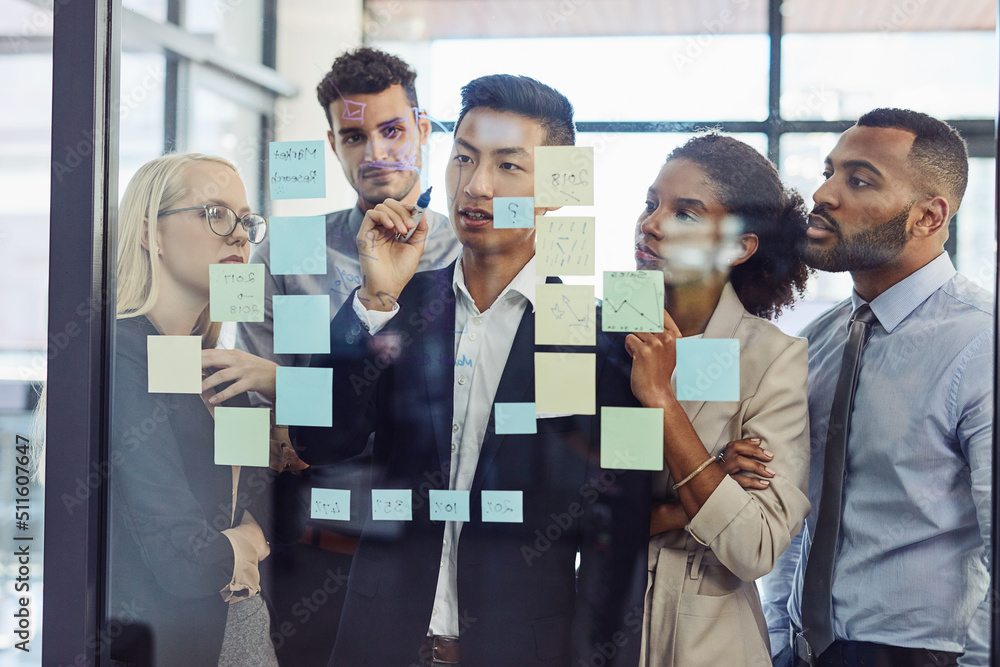 © Nola V/peopleimages.com - Making everyone part of the process of success. Shot of a group of young businesspeople having a brainstorming session together in a modern office.