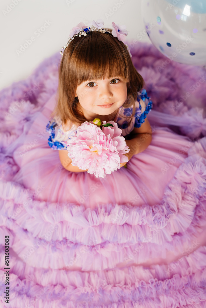 Portrait of a girl three years old in a pink dress Portrait of a girl three years old in a pink dress