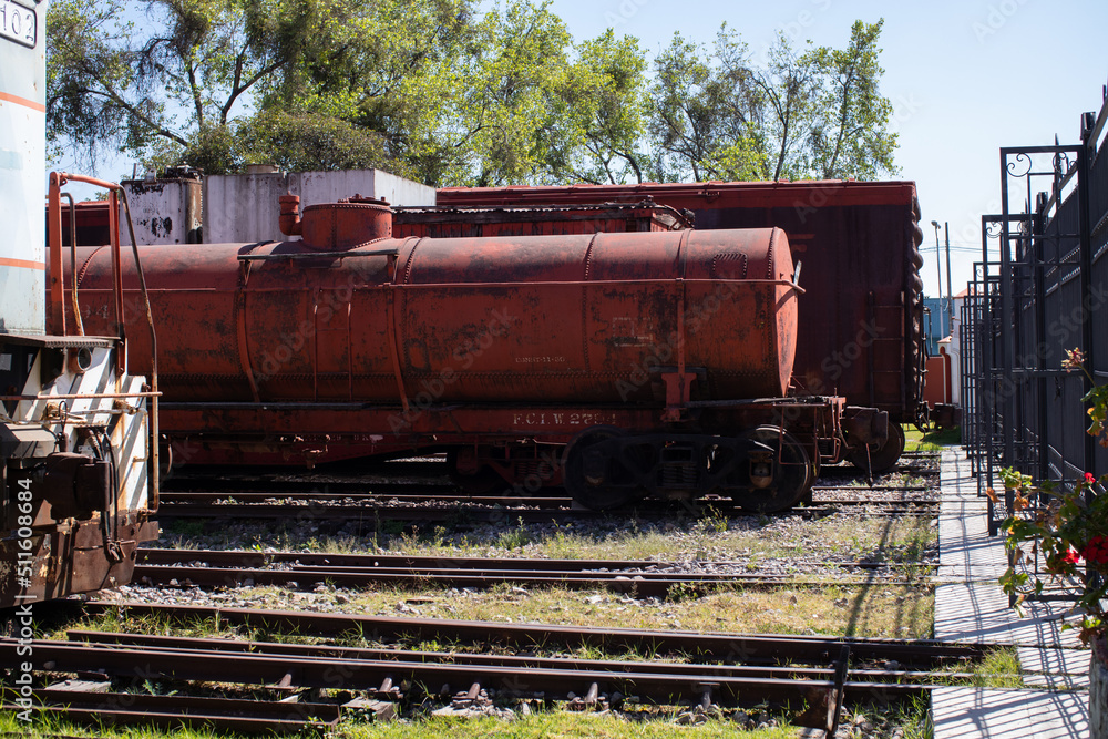 old  red train tanker sitting on the rain track station, museum of railway