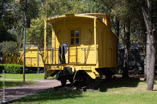 old yellow train wagon front view in a natural environment © Alan