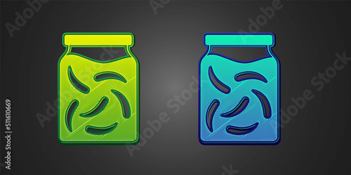 Green and blue Pickled cucumbers in a jar icon isolated on black background. Vector