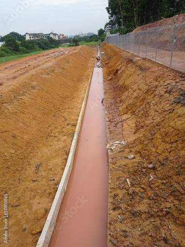 Temporary sediment and sludge filters installed at construction sites. All water from the nearest construction site is drained here and filtered before being discharged into a normal drain.
 photo