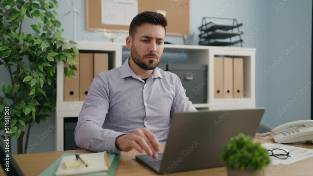 Young hispanic man business worker finish to work at office Young hispanic man business worker finish to work at office