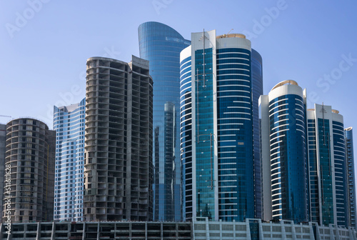  Modern high-rise residential and office buildings on Al Reem island in Abu Dhabi, UAE © Blazenka