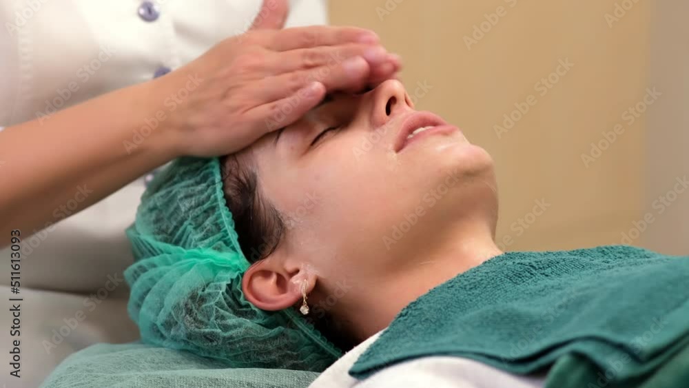 close up hands of cosmetologist cleanses the face female patient of acne. Professional skin care products. Beauty salon. Facial cleaning
close up hands of cosmetologist cleanses the face female patient of acne. Professional skin care products. Beauty salon. Facial cleaning