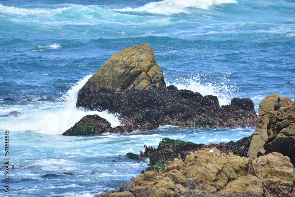 waves crashing on rocks in ocean waves crashing on rocks in ocean