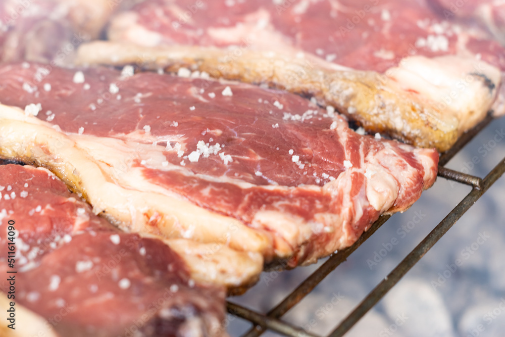 Obraz premium close-up of salt-baked cutlets cooking on the barbecue grill