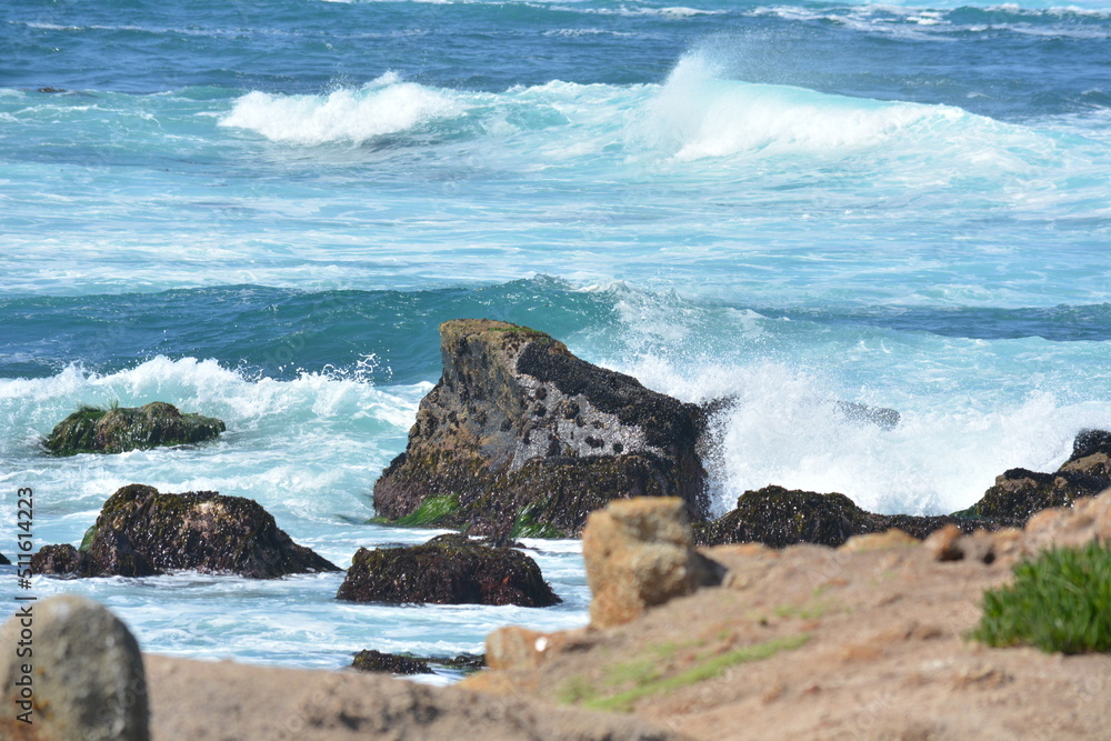 waves crashing on rocks in ocean