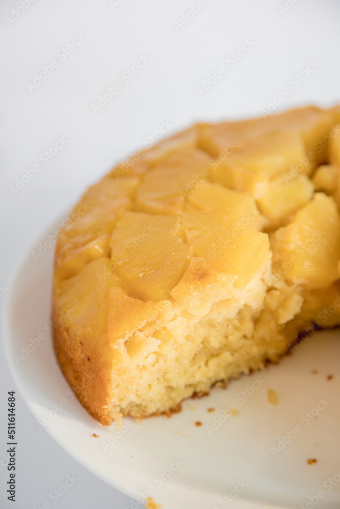 Moist and delicious homemade pineapple cake. White background, top view.