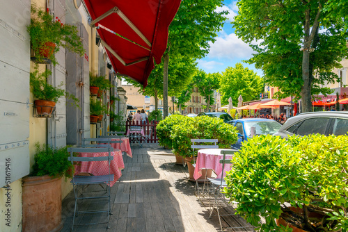 A sidewalk cafe in the historic medieval town of Saint-Remy-de-Provence, France, a picturesque city in the Provence-Alpes region near the French Riviera.