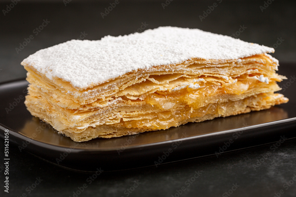 Mille feuille dessert on the plate.