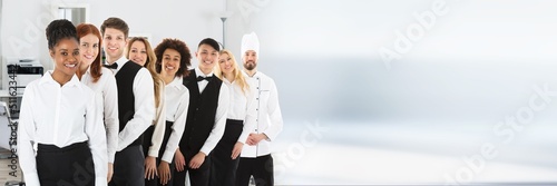 Fototapeta Confident Restaurant Staff Standing In Row
