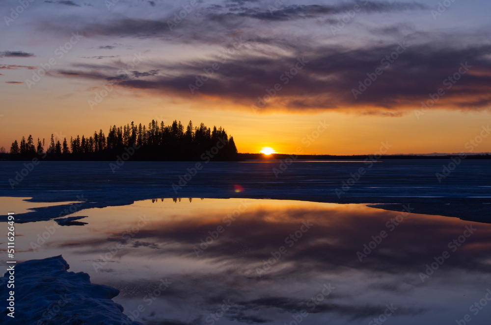 Beautiful Sunset over a Partially Frozen Astotin Lake