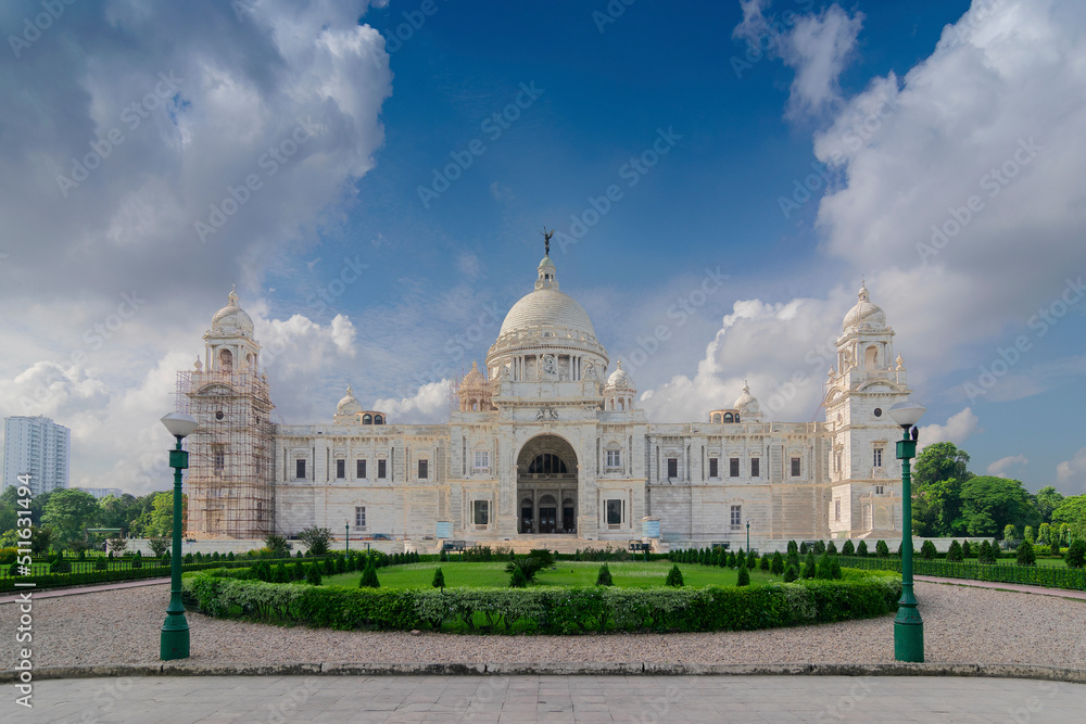 Landmark historical building made of white marbles - Victoria Memorial of Kolkata , West Bengal, India. A very popular tourist attraction for travellers , traveliing at Kolkata.