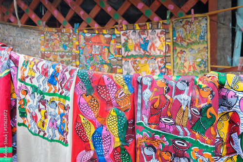 PINGLA, WEST BENGAL , INDIA - NOVEMBER 16TH 2014 : Colourful handicrafts are being prepared for sale in Pingla village by Indian rural worker. Handicrafts are rural Industry in West Bengal.