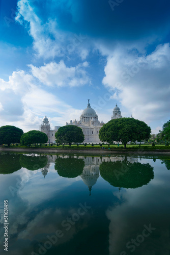 Victoria Memorial, Kolkata , Calcutta, West Bengal, India with blue sky and reflection on water. A Historical Monument of Indian architecture, to commemorate Queen Victoria's 25 years reign in India.