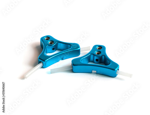 Blue color anodized aluminum triangle cantilever brake cable hangers, bicycle spare parts, on a white background.