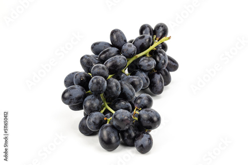 Black Grapes isolated in white background; water drops; studio lighting; macro detailing, negative space for copy