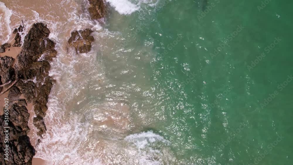 Aerial view Top view of Beautiful tropical sea sandy beach and waves crashing against sand beach from above Beautiful sea surface at Phuket Patong beach is famous tourist destination Aerial view Top view of Beautiful tropical sea sandy beach and waves crashing against sand beach from above Beautiful sea surface at Phuket Patong beach is famous tourist destination