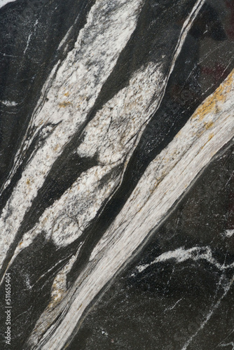 Close up of stone slab shows beautiful natural mineral pattern that perhaps flowed in Paleolithic period, resulted in stunning graphic in various forms under the crust. Unique in characters are formed