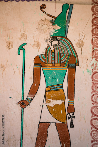 hieroglyph wall painting of horus egyptian god in valley of the kings, luxor egypt holding ankh photo