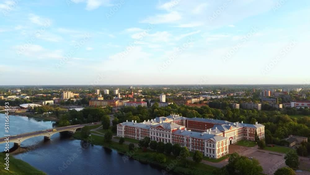 Aerial View of Jelgava City Panorama LLU Palace in Latvia, Zemgale. Largest Baroque Style Castle in Baltics on the Lielupe River Bank. Aerial Jelgava City Sunset View. Aerial View of Jelgava City Panorama LLU Palace in Latvia, Zemgale. Largest Baroque Style Castle in Baltics on the Lielupe River Bank. Aerial Jelgava City Sunset View.