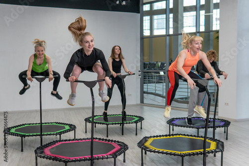Fitness center group active trampoline friends youth health aerobic training, concept team workout from sport from body indoor, sportswear teamwork. Motion club room,
