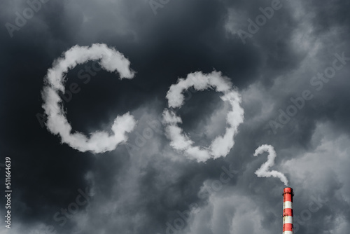 фотографія Air pollution by smoke coming out of factory chimney