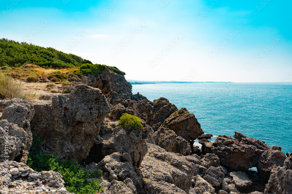 The coast and beaches of Turkey Alanya. The landscape of the cliff of the seashore from a height. Vacation on the beach in Turkey