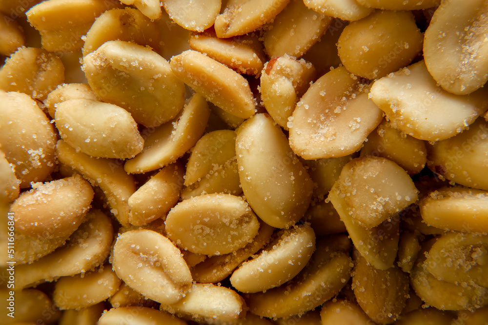 Close up of fried, peeled and salted peanuts. Close up of fried, peeled and salted peanuts.