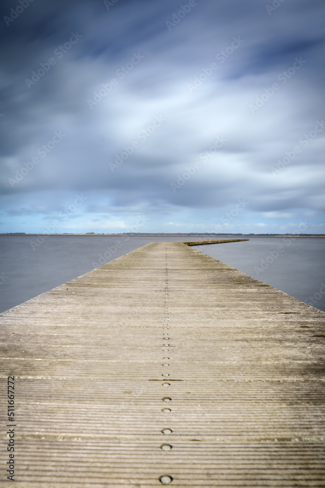 Long bent Jetty on a Cold Day at a Dutch Lake