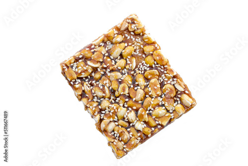 Peanut  mixed with sesame cereal bar, crispy crackers, Thai traditional snack that made from grains on white background. 
Shaped as a square bar, the taste is sweet and crispy from caramelized sugar.