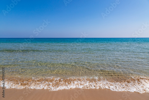 A view out over the sea at Golden Beach in Cyprus, with a clear sky overhead © lemanieh
