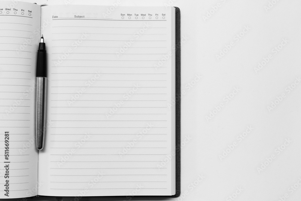Pen on Notebook Isolated on the White Background Pen on Notebook Isolated on the White Background