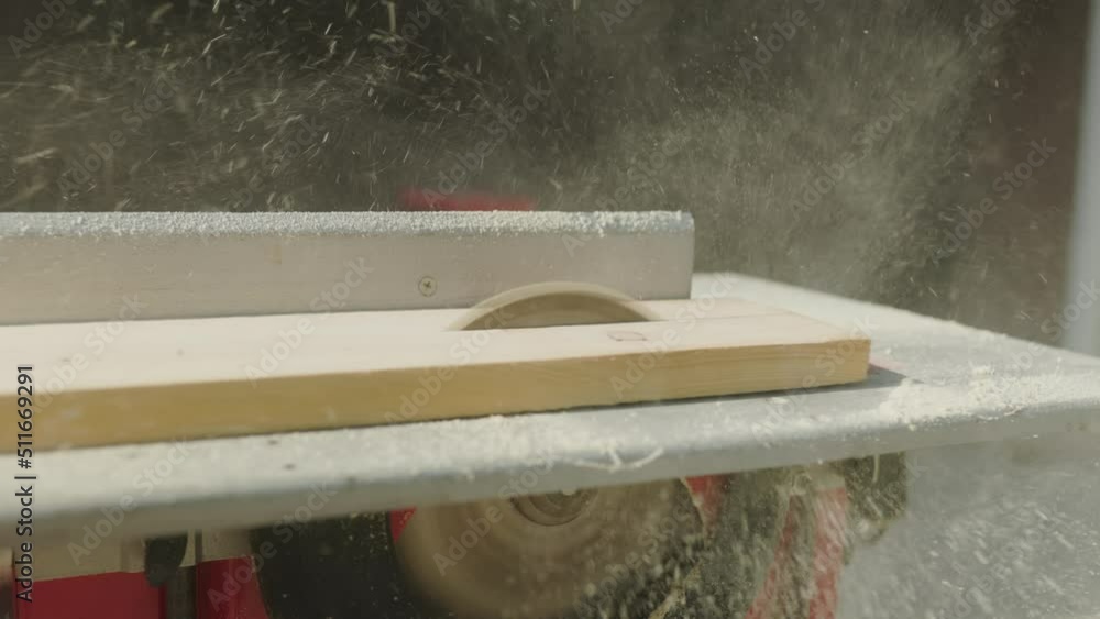 circular saw sawing or cutting wood flying chips circular saw sawing or cutting wood flying chips