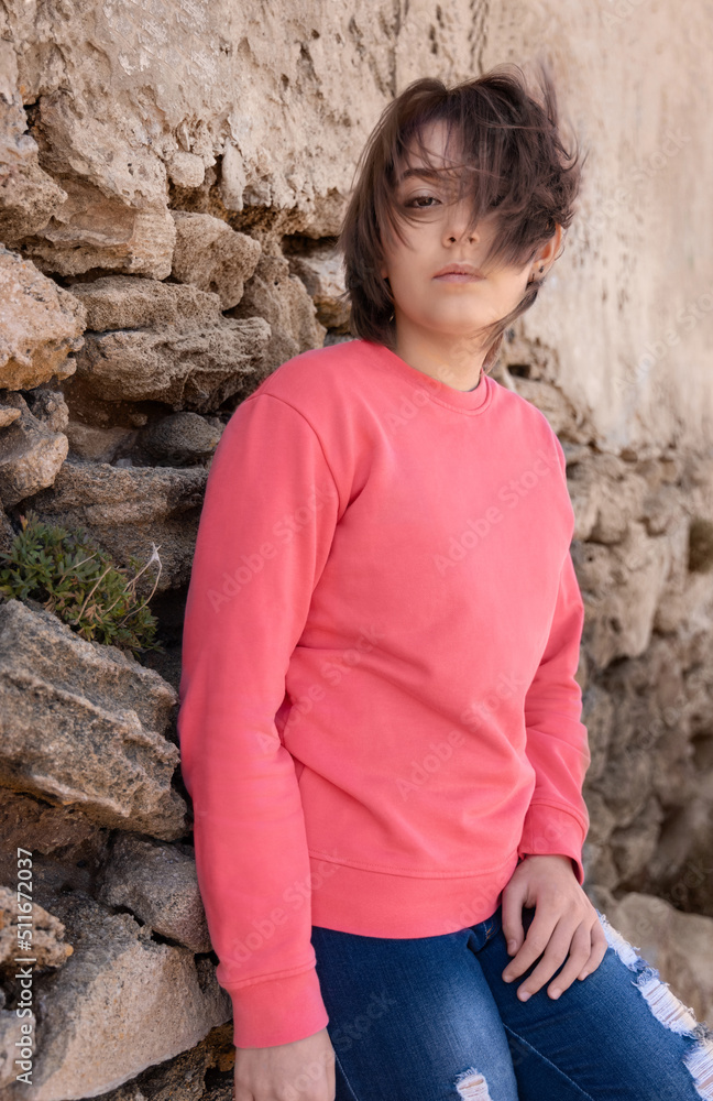 Teenager girl wearing pink long sleeve shirt standing outdoor, mockup Teenager girl wearing pink long sleeve shirt standing outdoor, mockup
