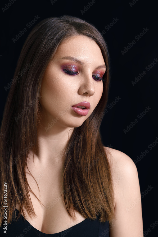 vertical beauty portrait of a brunette woman on a black background. vertical beauty portrait of a brunette woman on a black background.