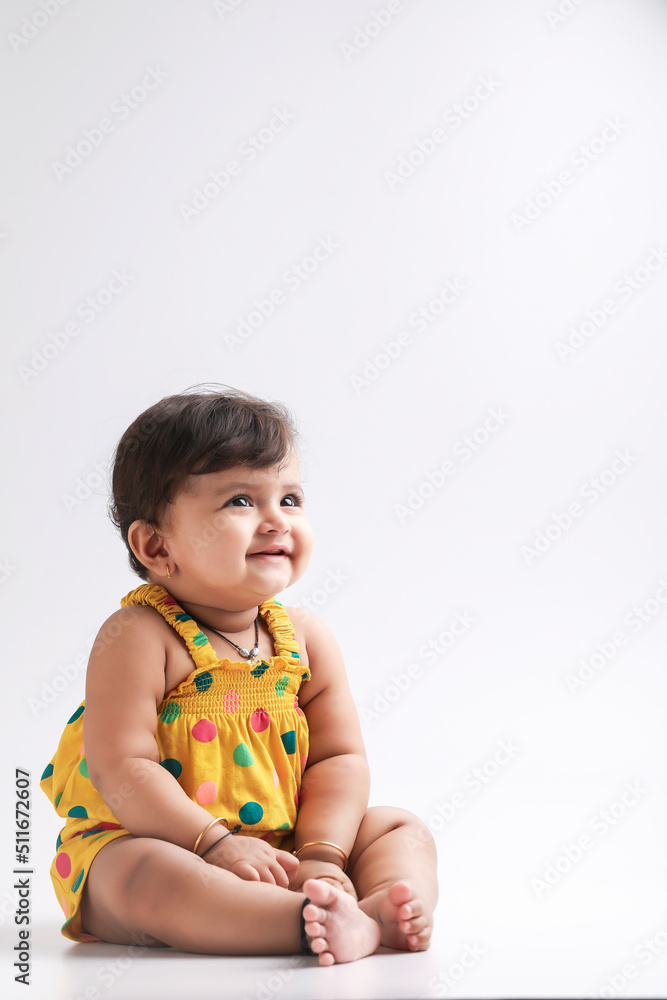 Cute indian baby girl smiling and giving expression. Cute indian baby girl smiling and giving expression.