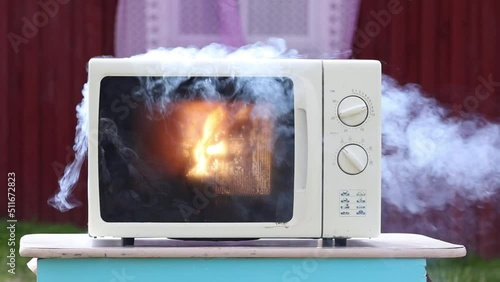 Short circuit in microwave oven wiring led to an electrical fire.