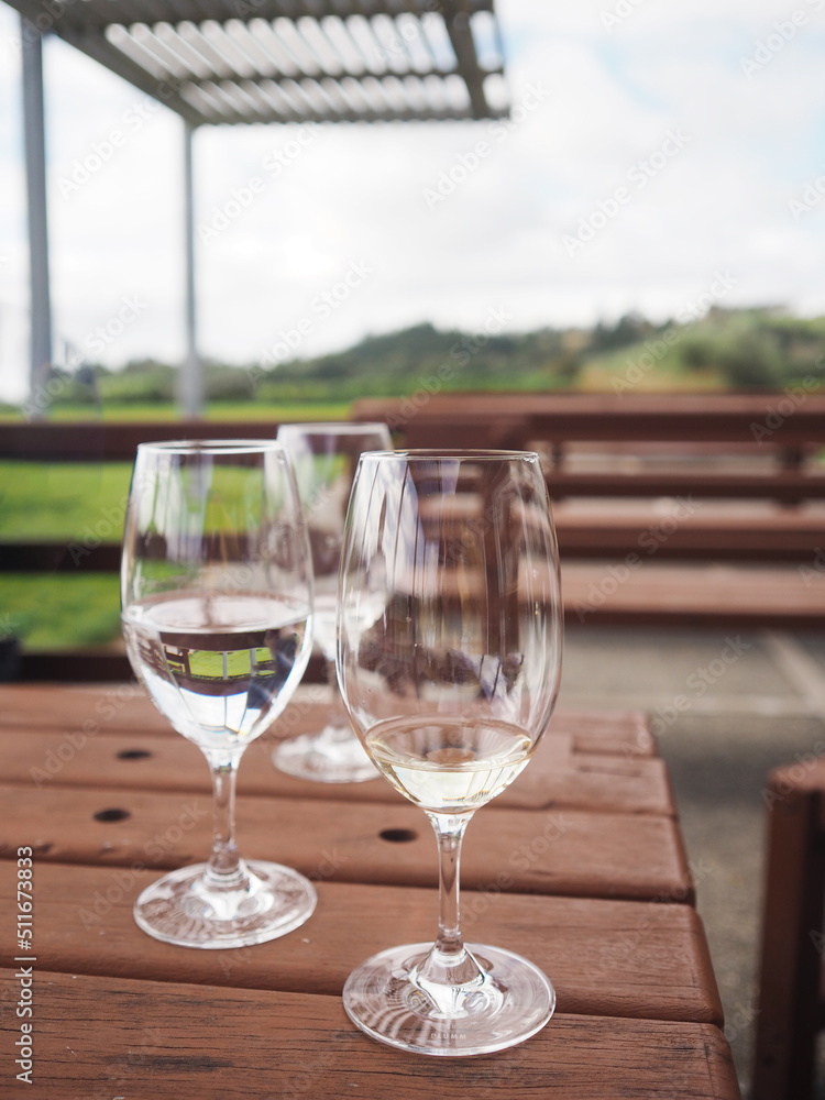 Empty Wine glasses are set on a wooden table Empty Wine glasses are set on a wooden table