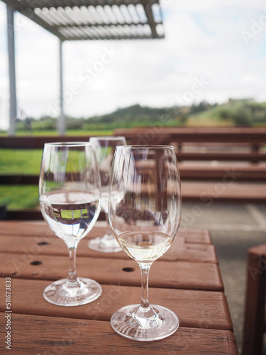 Empty Wine glasses are set on a wooden table