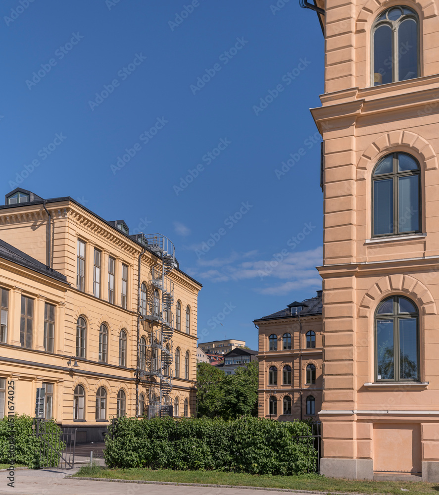 Buildings from old mint office and apartment house on the hill Kungsklippan a sunny summer day in Stockholm